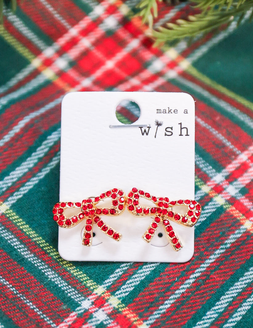 Rhinestone studded bow earrings.