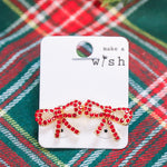 Rhinestone studded bow earrings.