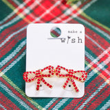 Rhinestone studded bow earrings.