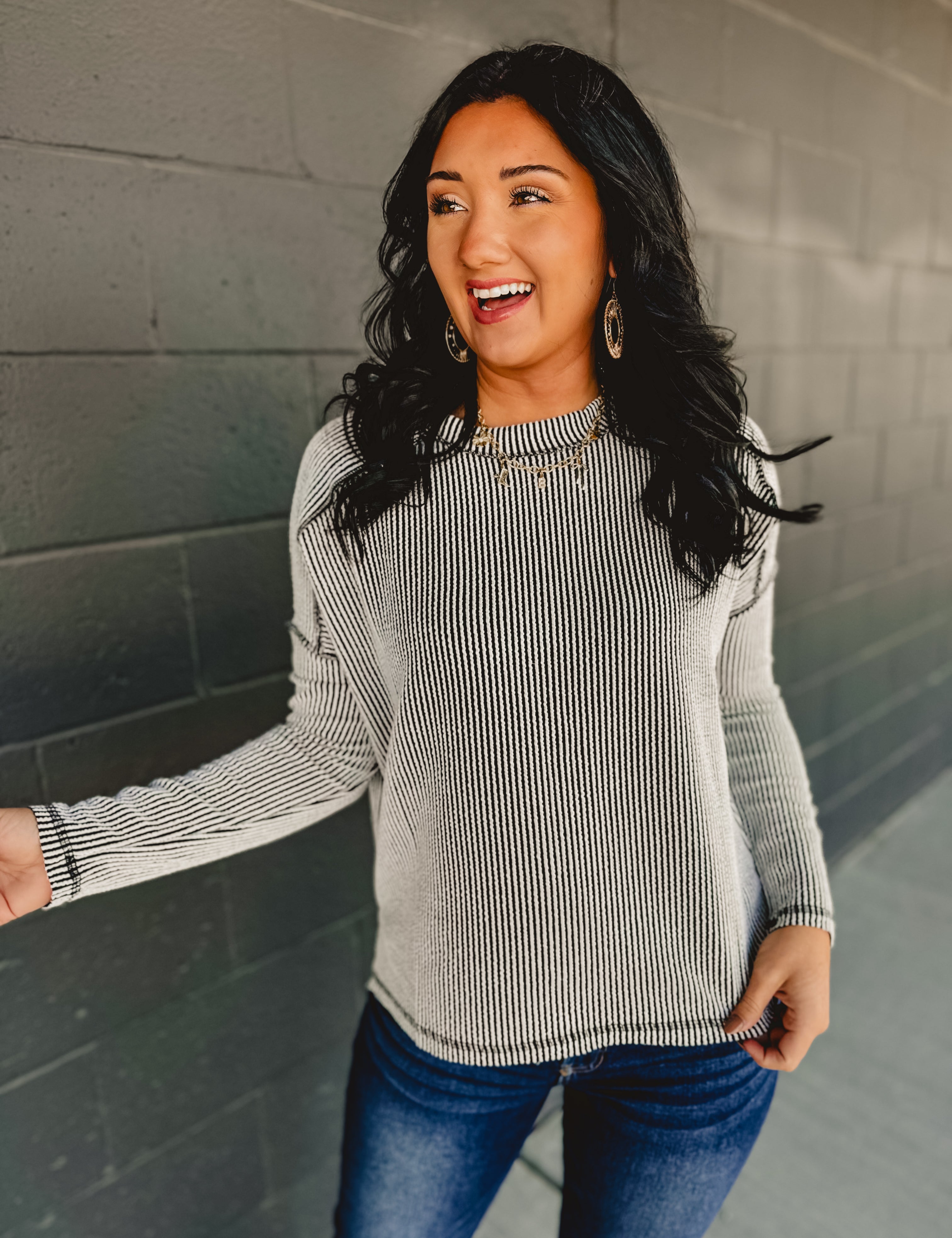 Ribbed material long sleeve top in black/white.
