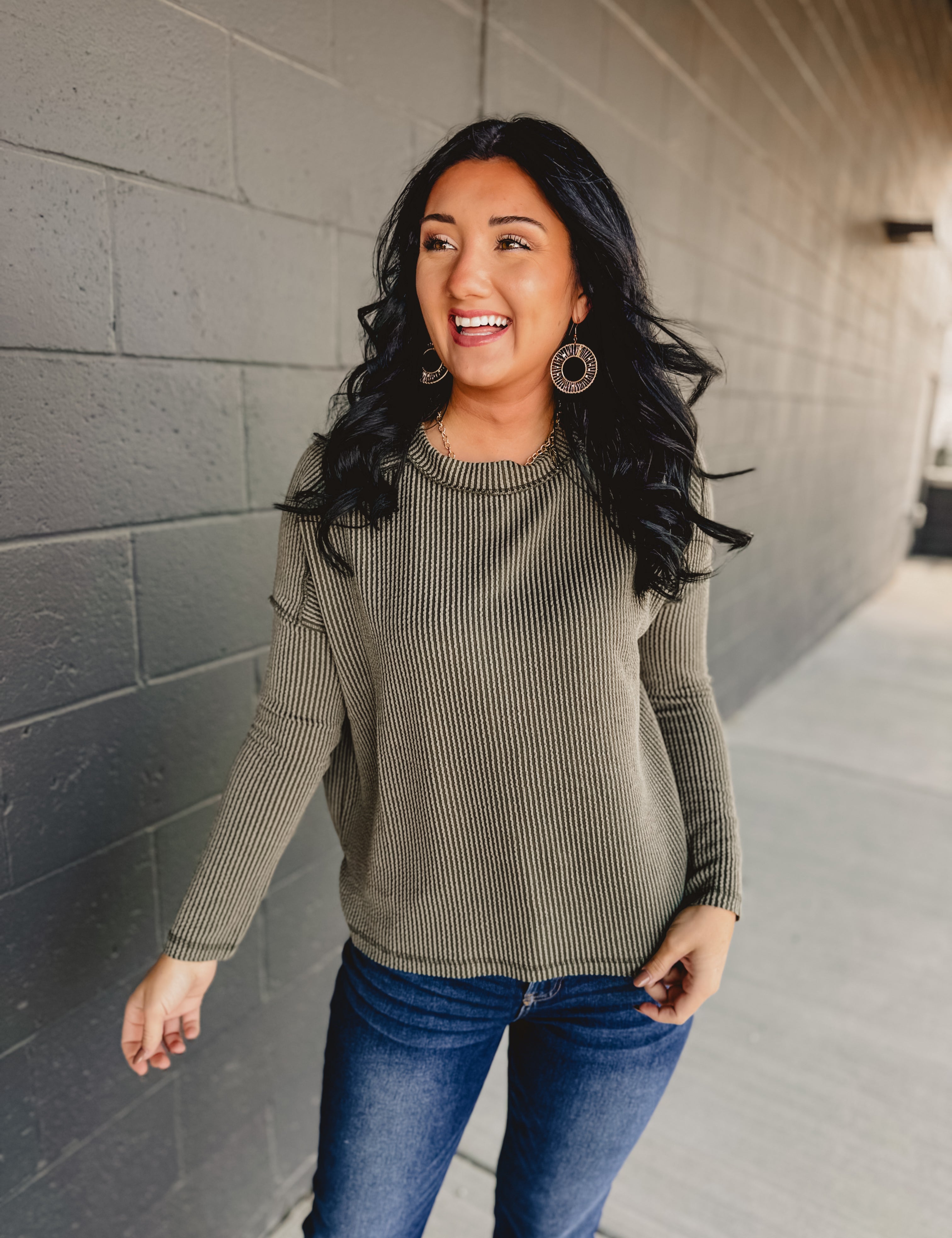 Ribbed exposed seam long sleeve top in dark olive.