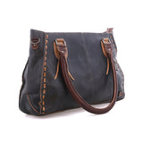 Side view of the Java Rustic Rockababy showing brown padded handles and tan contrast stitching along the leather panels