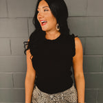 Ruffle edged black ribbed full length sweater tank top.