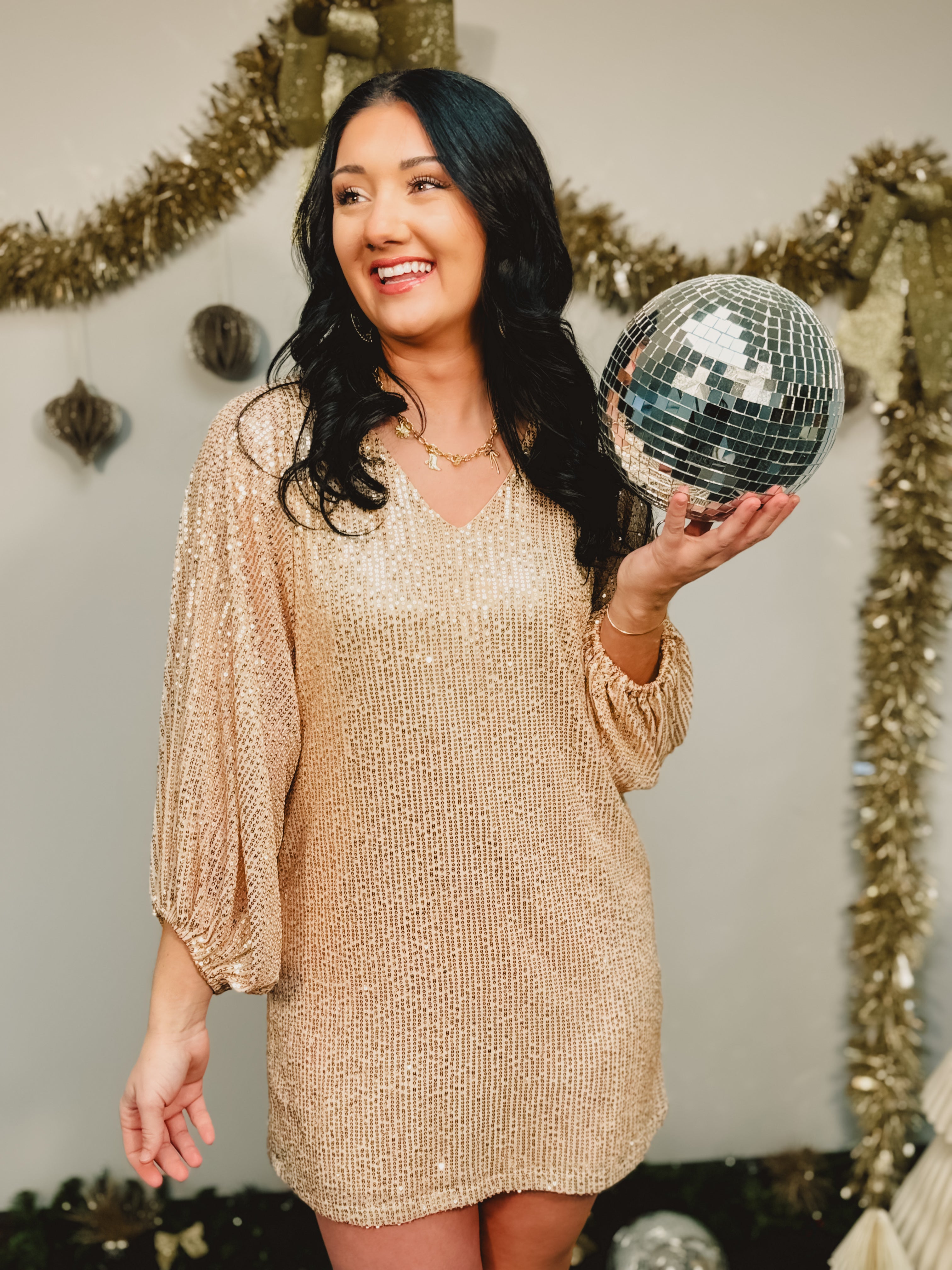 Sequin balloon sleeve v-neck mini dress in gold.