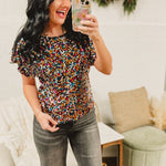 Sequin boat neck dolman sleeve top in multicolor.
