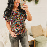 Sequin boat neck dolman sleeve top in multicolor.