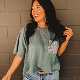 Oversized mineral wash drop shoulder short-sleeved boxy silhouette tee with crochet pocket in the color faded teal.