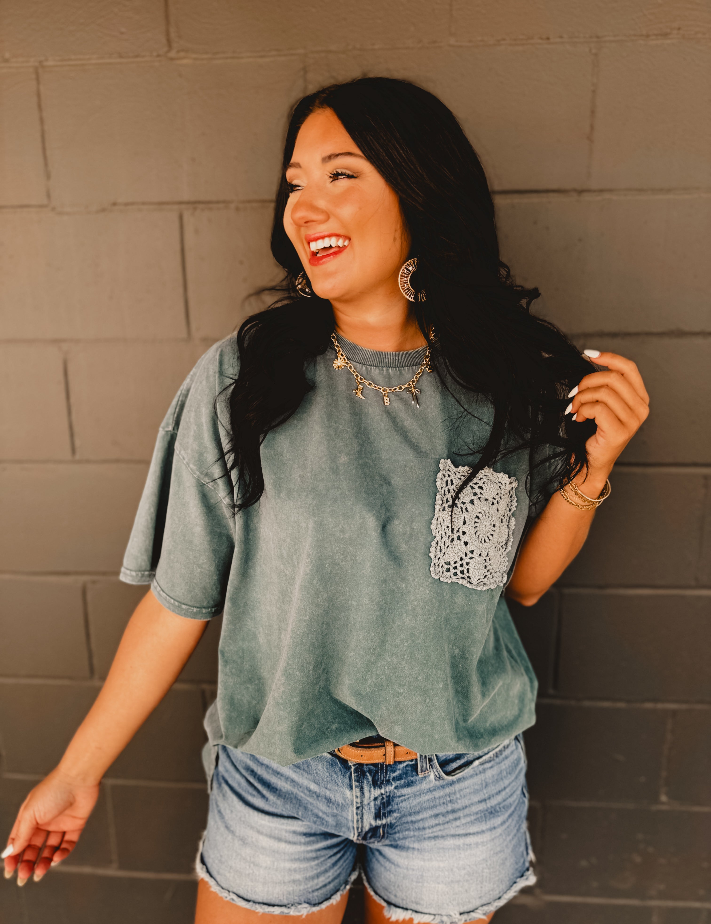 Oversized mineral wash drop shoulder short-sleeved boxy silhouette tee with crochet pocket in the color faded teal.