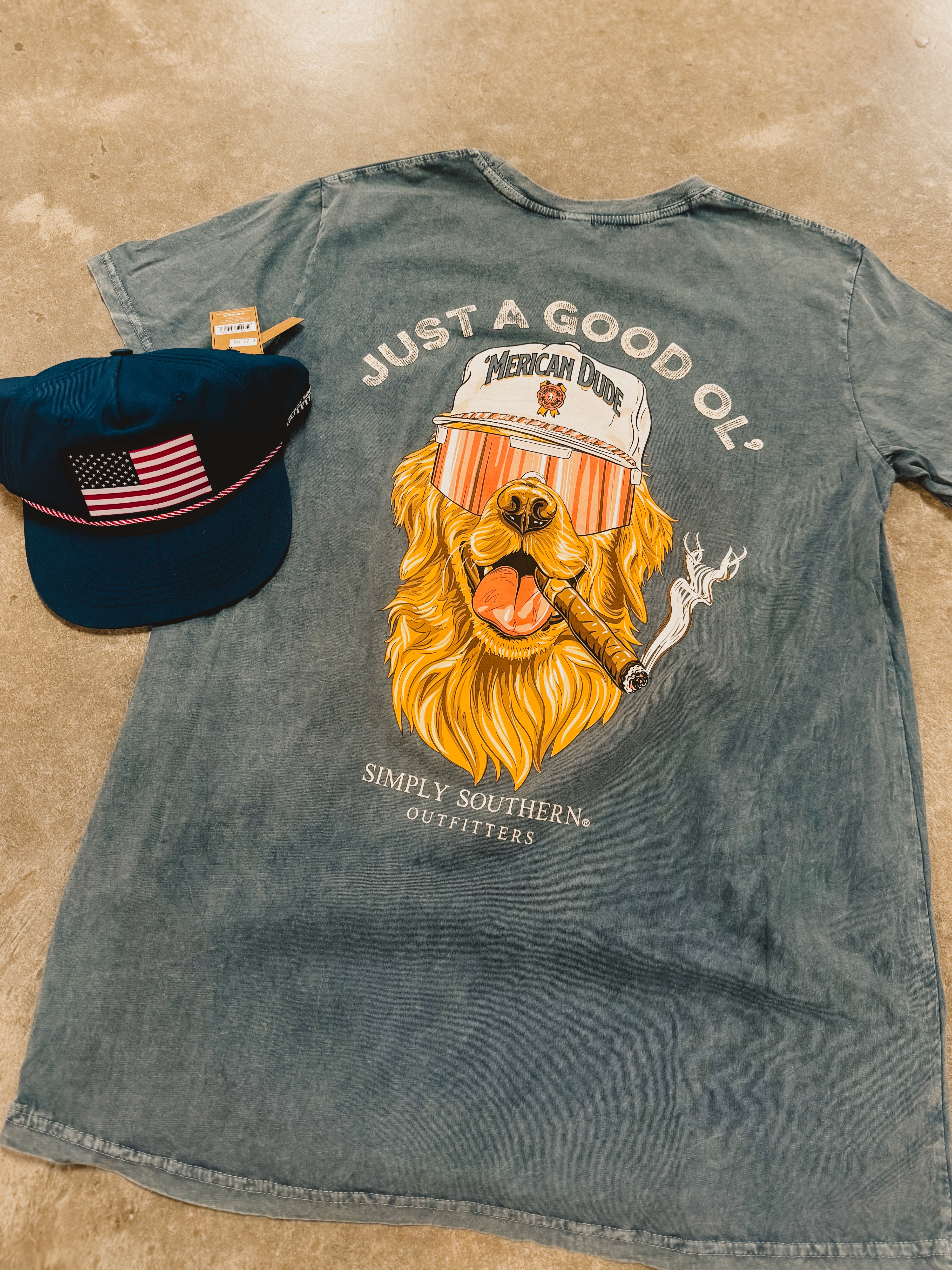 Get patriotic with the Simply Southern Men's 'Merican Tee - Coal. This tee provides endless comfort and is made from 100% Cotton. Its playful graphics make this a casual look.