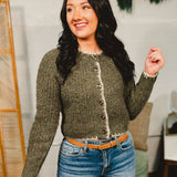 Speckled button down cardigan sweater top with contrast trim in olive.