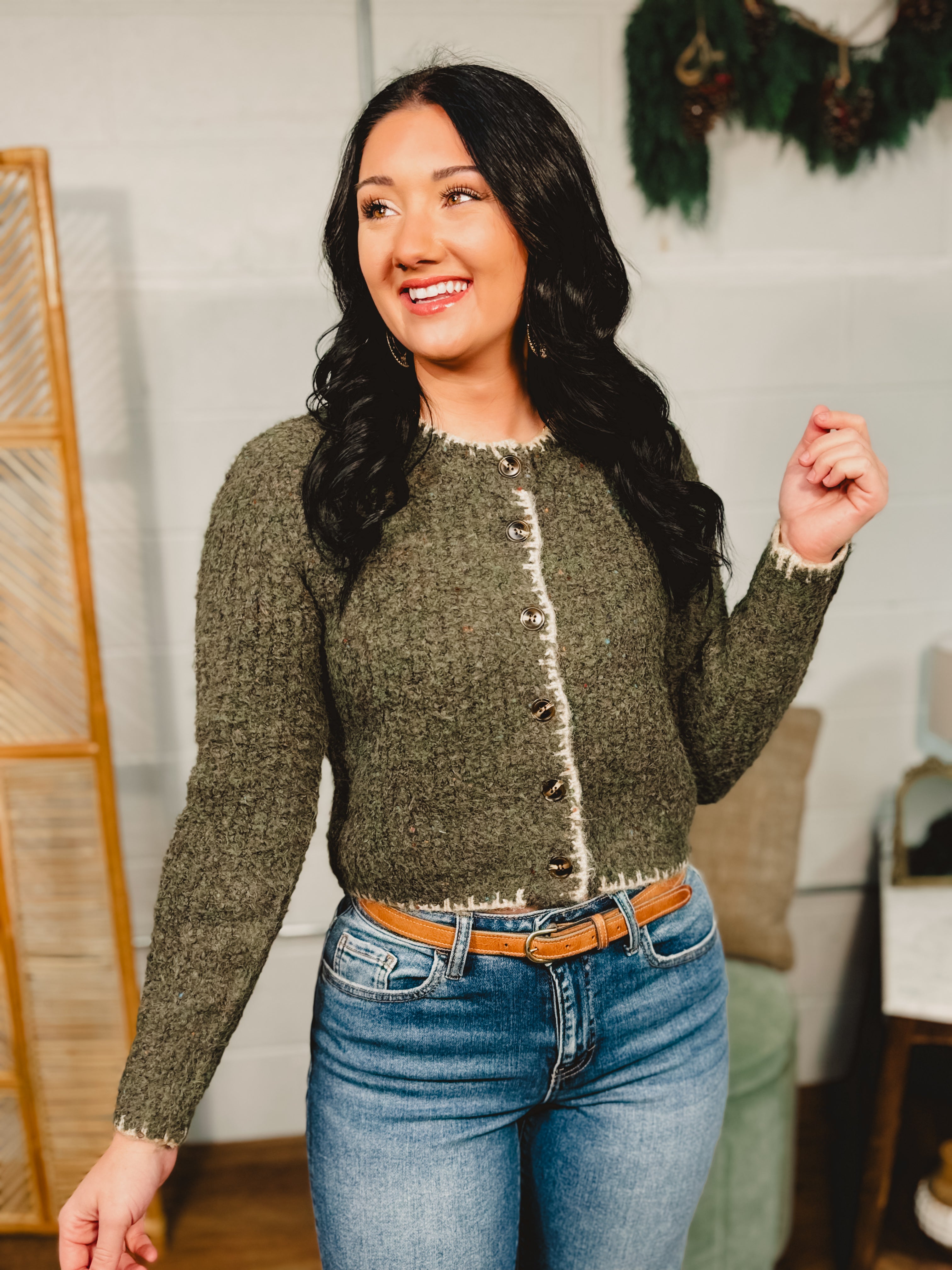 Speckled button down cardigan sweater top with contrast trim in olive.