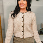 Speckled button down cardigan sweater top with contrast trim in taupe.