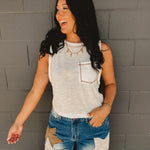 Sleeveless stitch detail and front pocket tank top in off white.