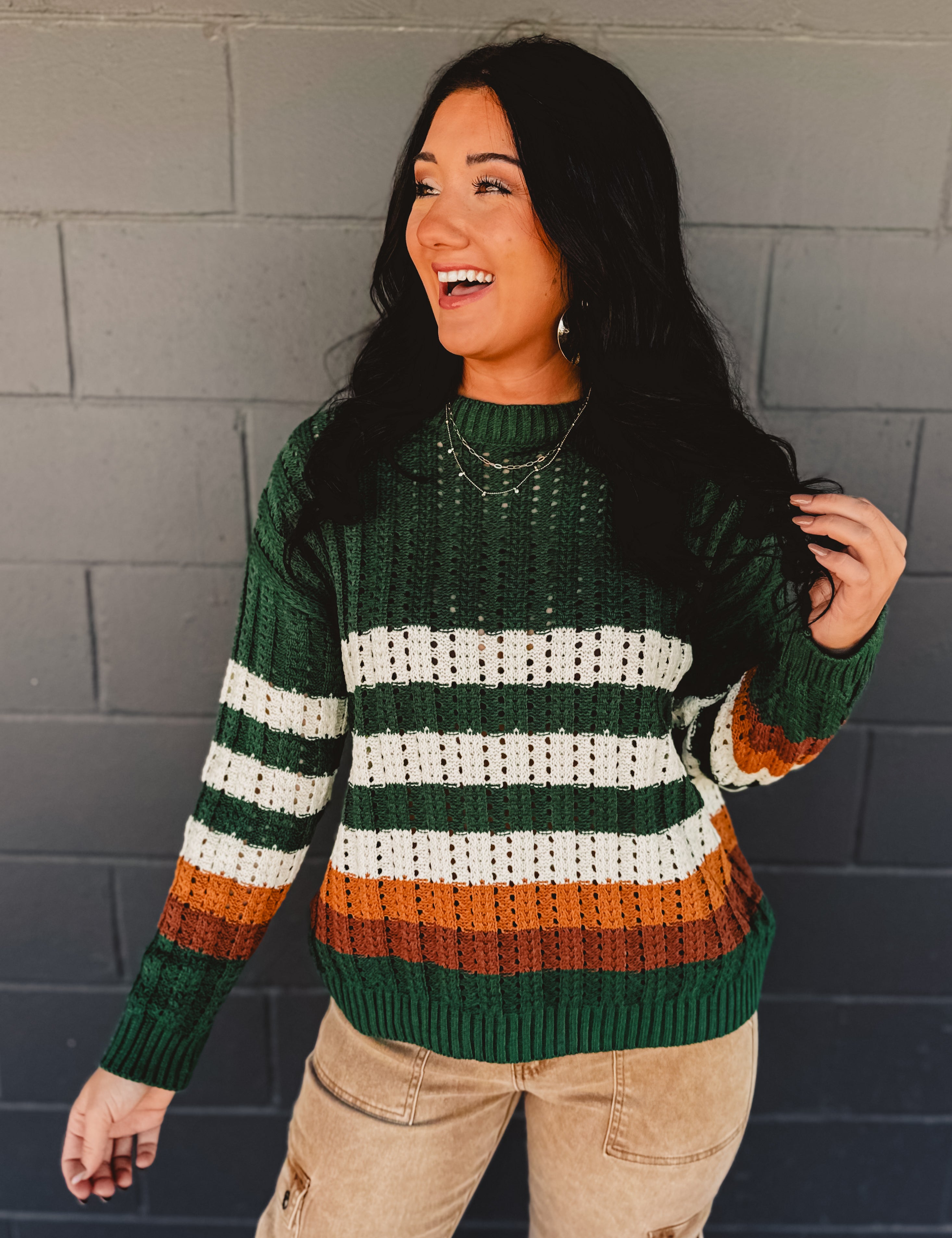 Striped detail crochet knit crewneck sweater in the color hunter green.