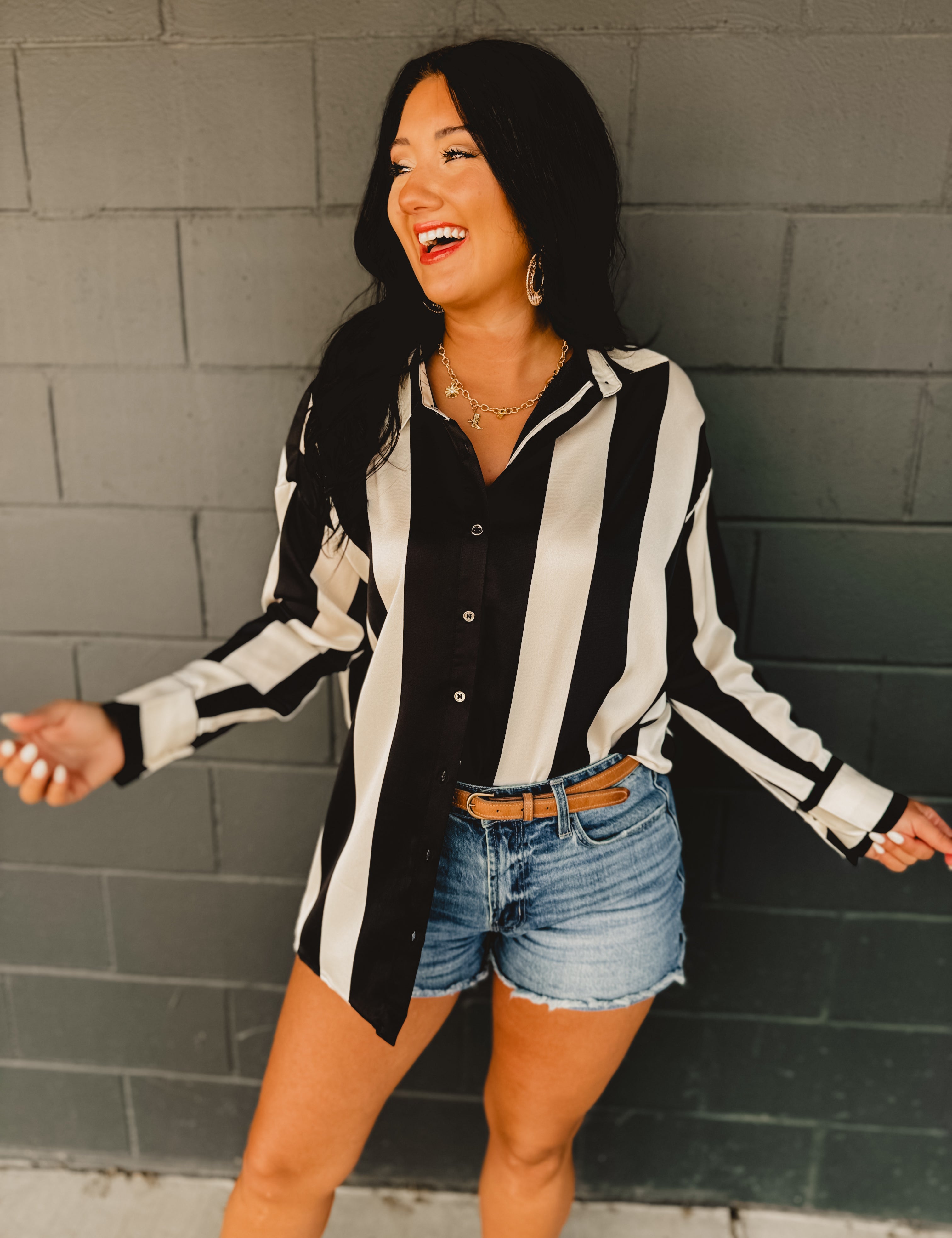 Striped satin button-up oversized blouse.