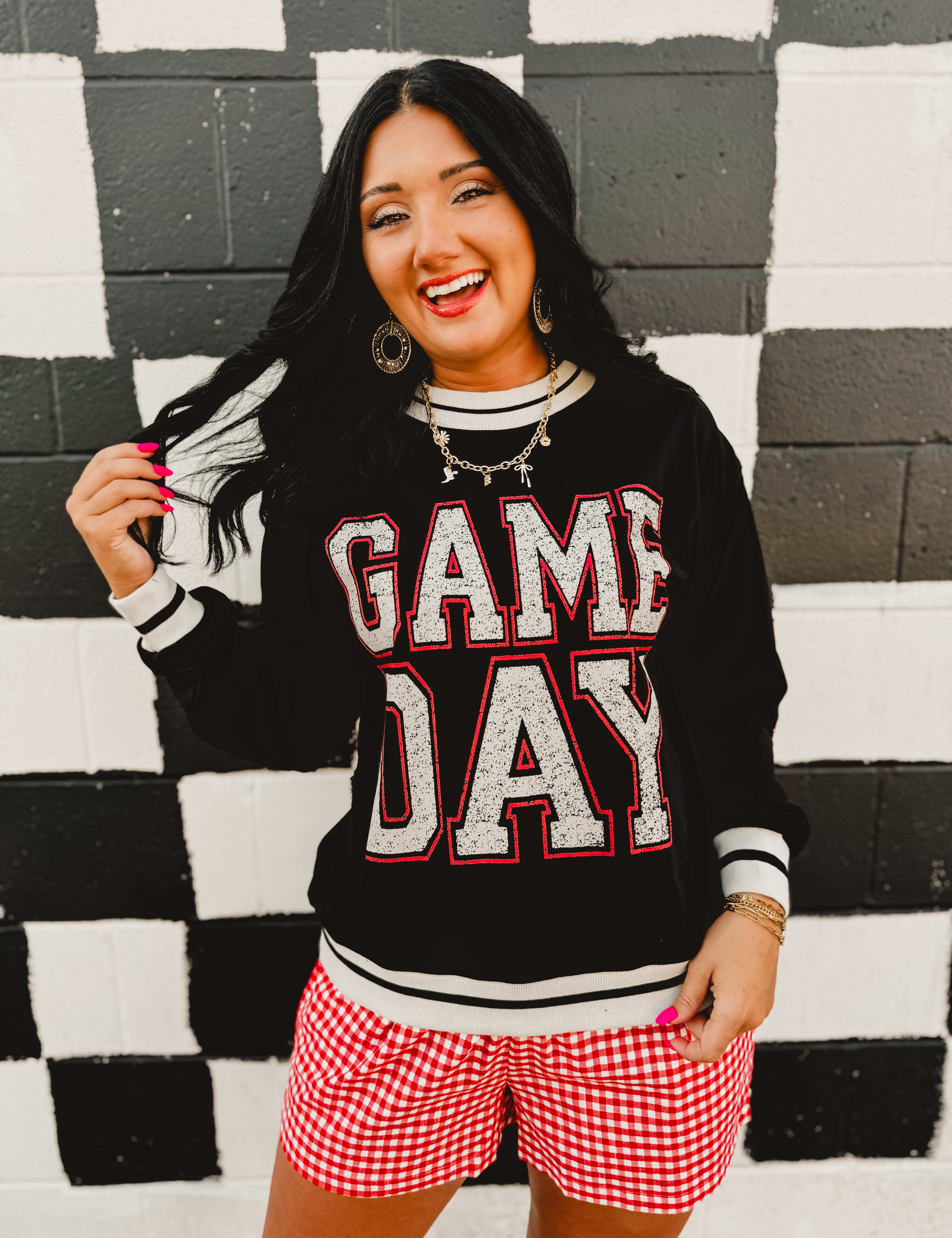"Game Day" contrast trim long sleeved top in black.