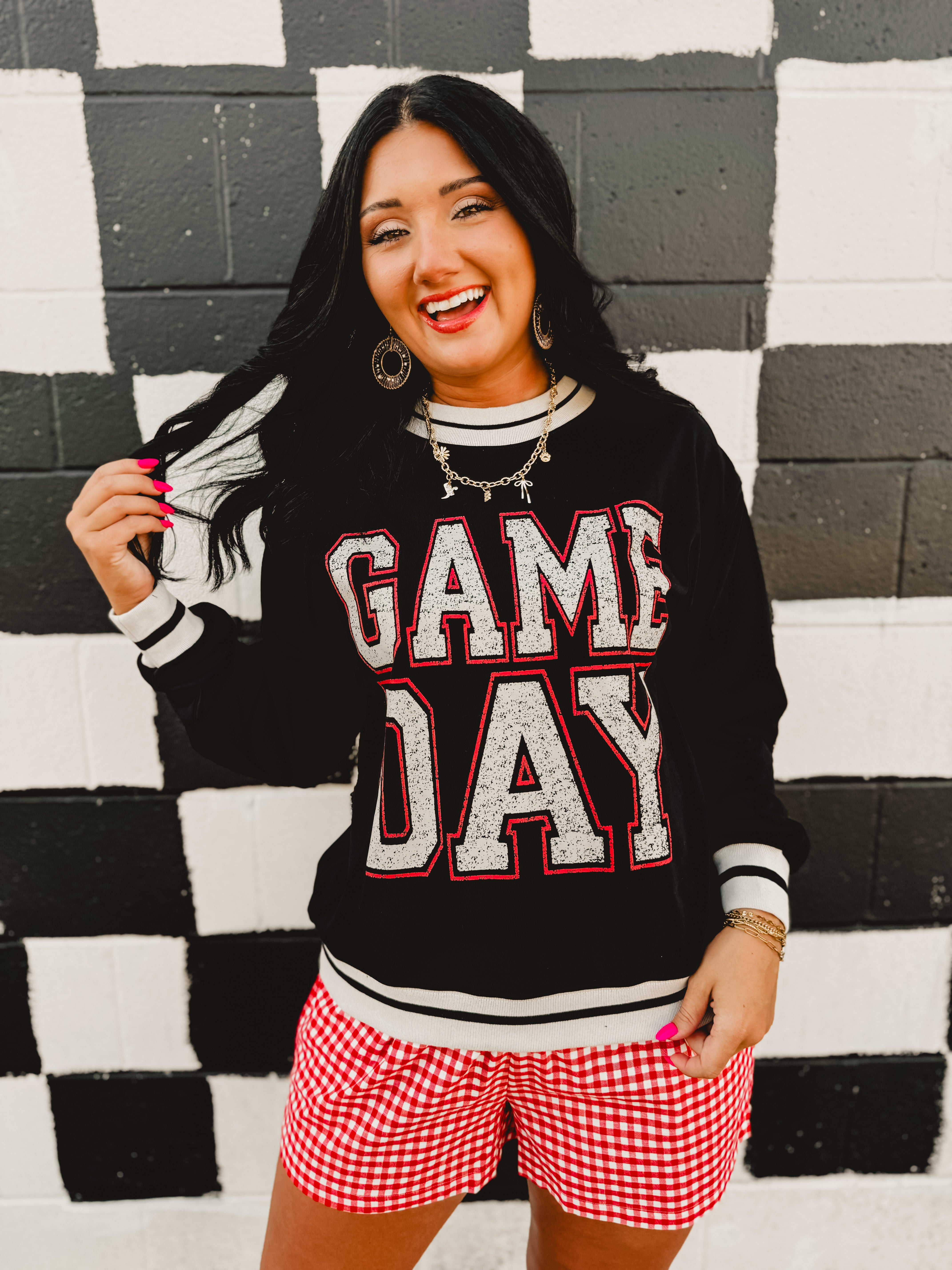 "Game Day" contrast trim long sleeved top in black.
