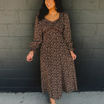 Sweetheart neckline long sleeve maxi dress with lace detail and floral print in brown.
