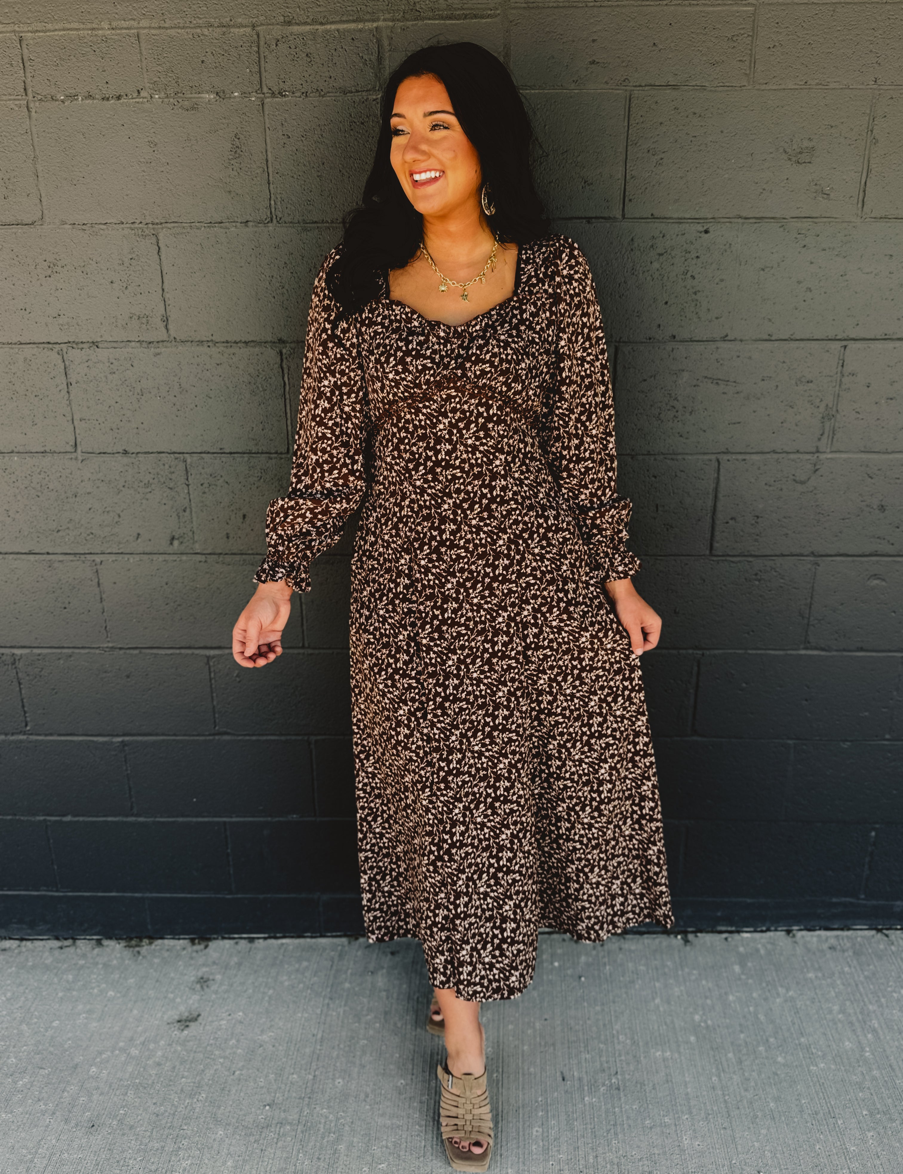Sweetheart neckline long sleeve maxi dress with lace detail and floral print in brown.