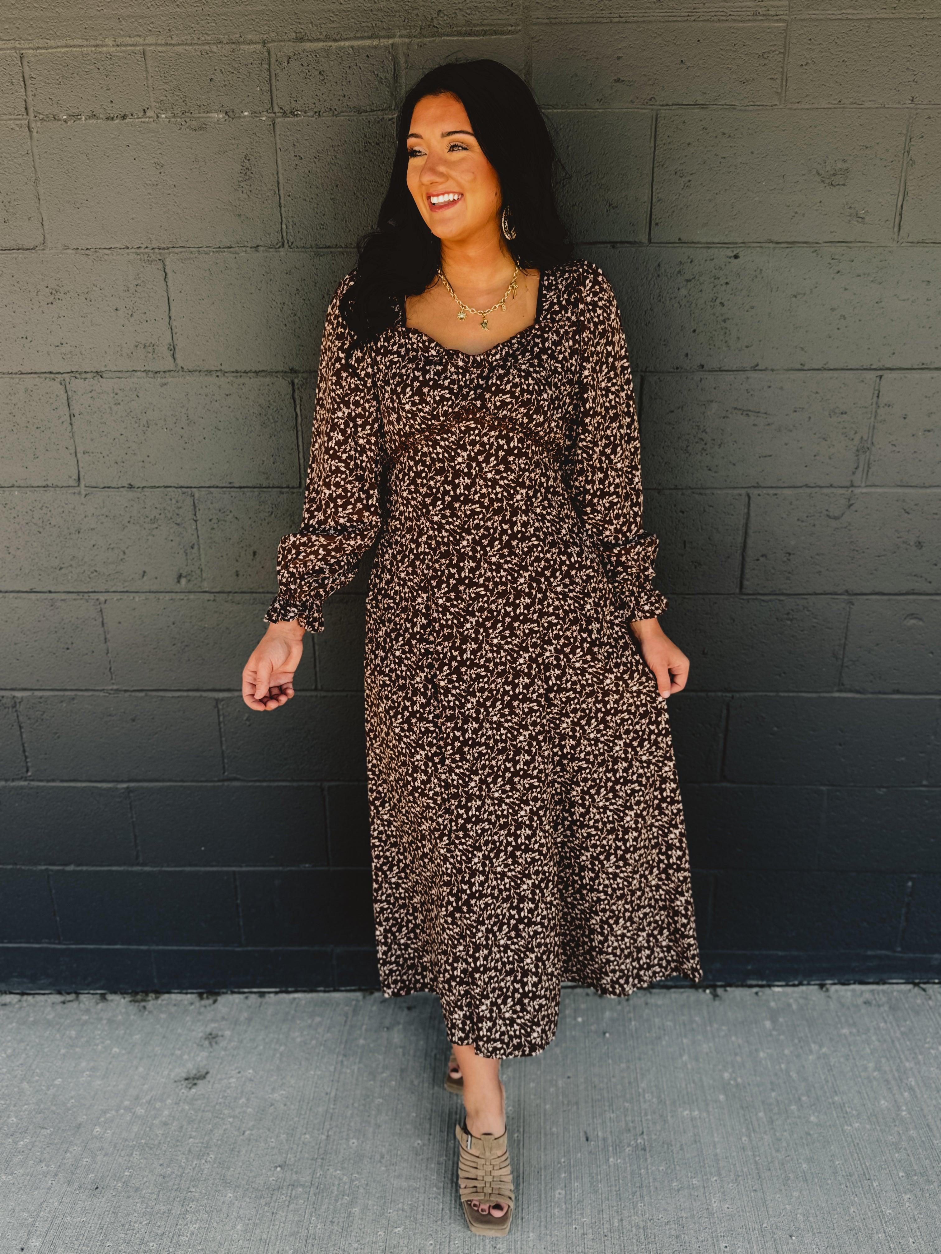 Sweetheart neckline long sleeve maxi dress with lace detail and floral print in brown.