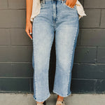 Two tone cropped carrel jeans with zip-up closure and stretch material.