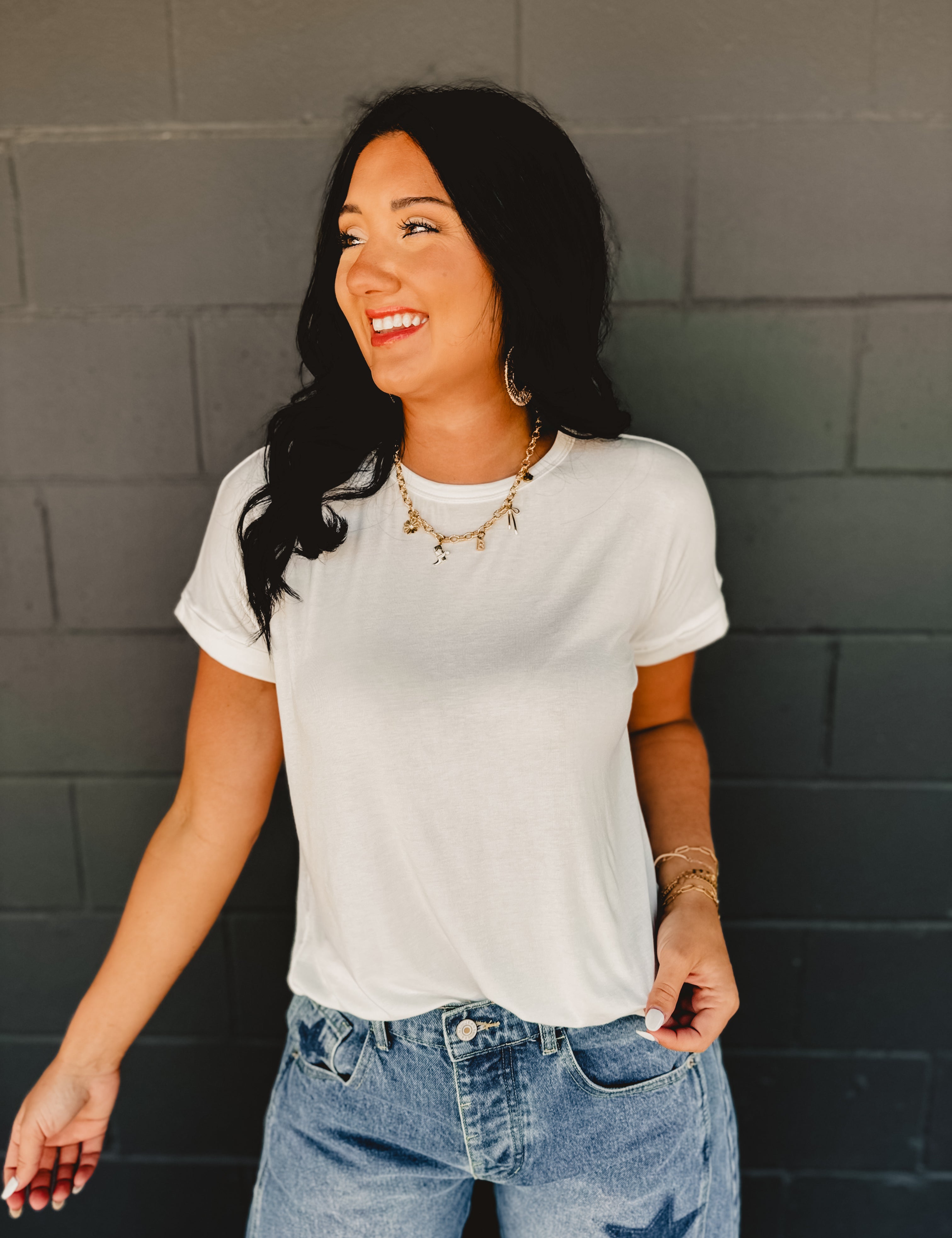 Rolled short sleeved round neck top in white.