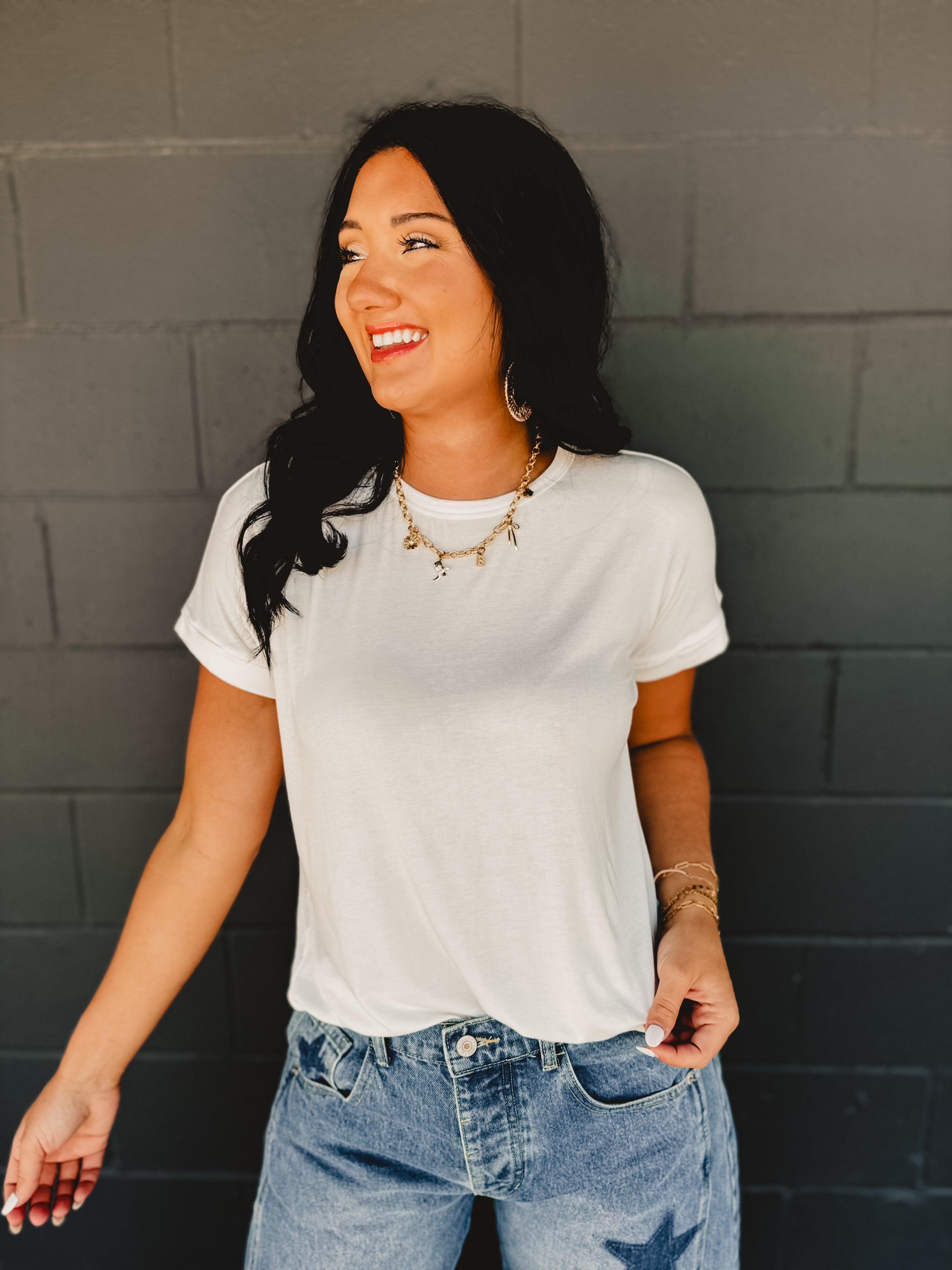 Rolled short sleeved round neck top in white.