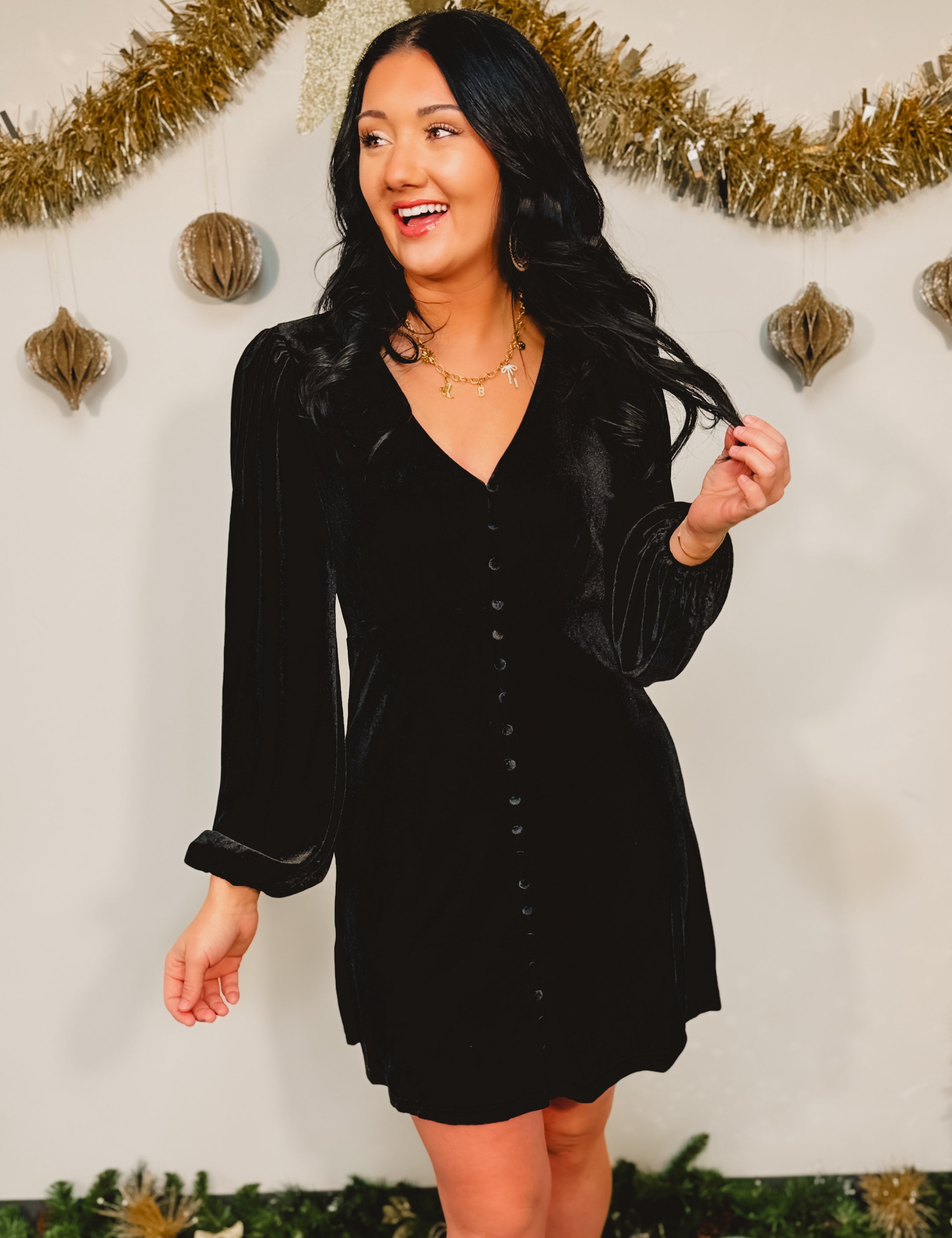 Velvet long sleeve v-neck button detail babydoll mini dress in black.