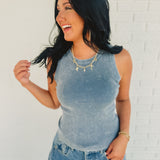 Dusty blue ribbed knit stretch tank with a round neck.