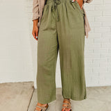 Linen drawstring wide leg pants with an elastic waistband and front pockets.